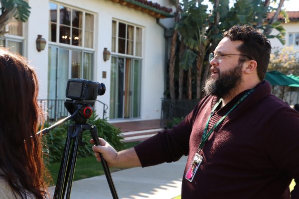 Film teacher Andrew Ruiz instructs his Advanced Film class in the courtyard and teaches about cine lenses. Visual Arts Department Chair Marya Alford observed one of his classes, watching students take on collaborative positions to create a film. It was really fun to see students enter different roles like cinematographer or director and just jump into those roles and take them seriously even if it wasnt their first choice, Alford said. It is all working towards the final result of the film.