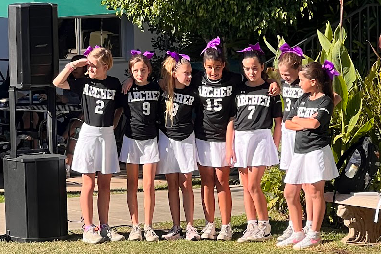 The cheer team prepares for their performance at the fall pep rally. For the first time this year, the cheer team began cheering at Archer’s home volleyball games. 