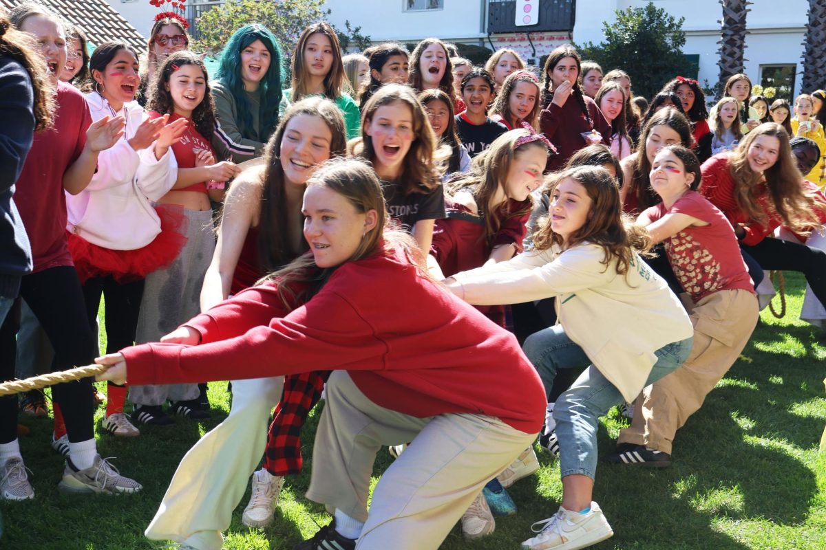 Led by Jackie Mayne (’28), eighth grade students participate in tug-of-war. Color Wars consisted of four activities — tug-of-war, mural decorating, door decorating and a relay race — in which students from different grade levels competed against each other to win Spirit Points. “It was really exciting because it’s just a fun way to show grade spirit, and it’s a fun way to bond with your friends,” Charlotte Stein (’26) said. “I think that the tug-of-war is always a highlight for Color Wars since we’ve been with the great rivalry, and then on the faculty comes in — I think that’s always a fun event.”