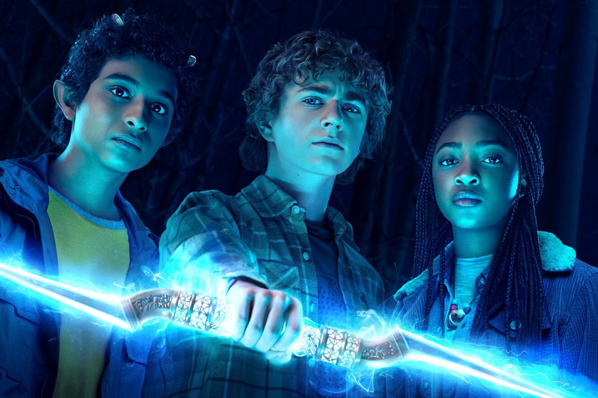 Percy Jackson (Walker Scobell) holds out Zeus’ lightning bolt, joined by Annabeth (Leah Jeffries) and Grover (Aryan Simhadri). “Percy Jackson and the Olympians” is a TV show adaptation of Rick Riordan’s books of the same name. The story focuses on the trio’s efforts to find and return the god’s bolt after Percy is accused of stealing it. Photo Credit: Disney+ Promotional Material.