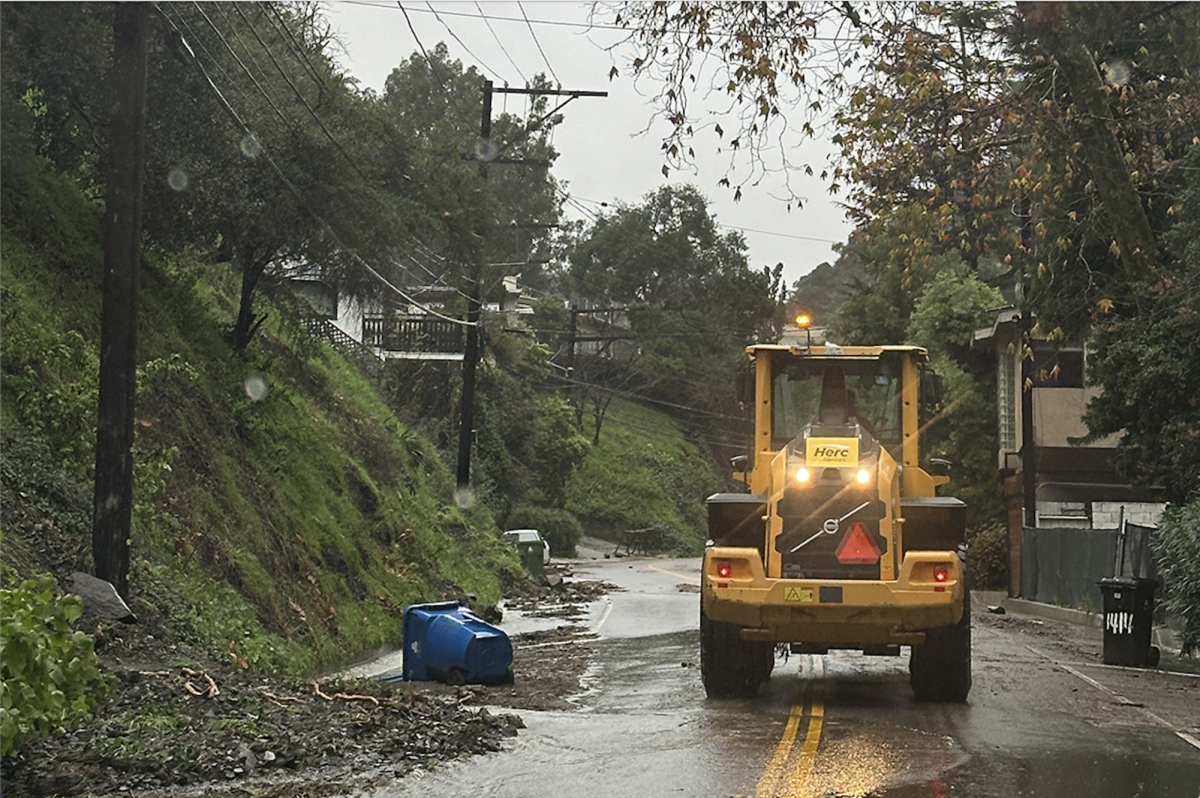 Rain floods the streets of L.A. as trashcans are skewed across the road. This wintertime, L.A. has been hit with stormy weather. In a survey, The Oracle asked the Archer community to reflect on what wintertime means to them.