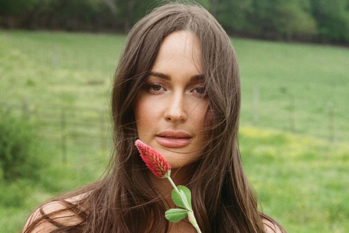 Upon a backdrop of lush greenery, Kacey Musgraves holds a flower to her face, creating the album cover for Deeper Well. The album, released March 15, details Musgraves internal rhetoric of peace, whimsy and everything in between. Photo credit: “Deeper Well” album cover courtesy of    Interscope Records .