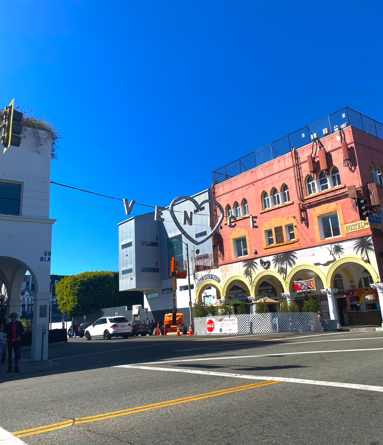 The signature Venice sign hangs between two buildings adjacent to Abbot Kinney Boulevard. Abbot Kinney is a well-known street in Venice beach filled with shops, restaurants and galleries. 