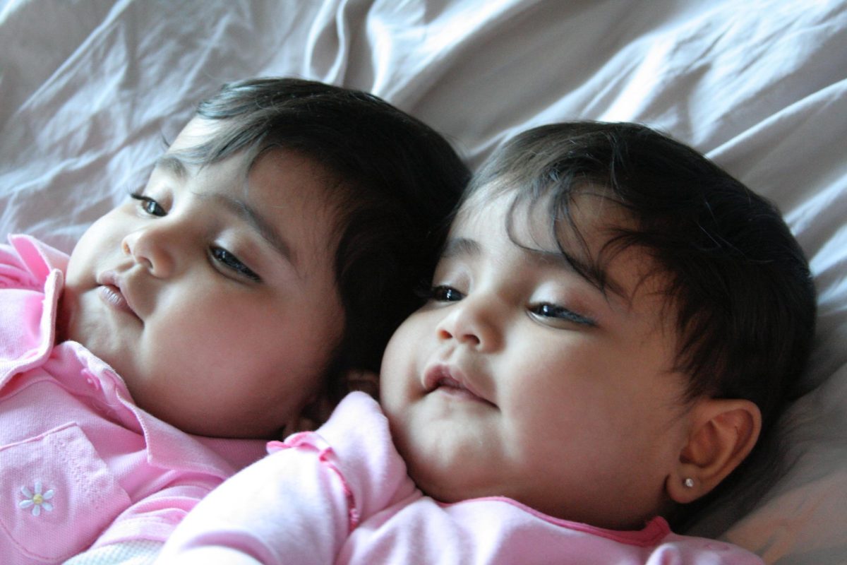 My twin sister Miya and I, as babies, lie on a blanket. Im so grateful that she and I had each others backs no matter what. Photo by Sanjay Nambiar.