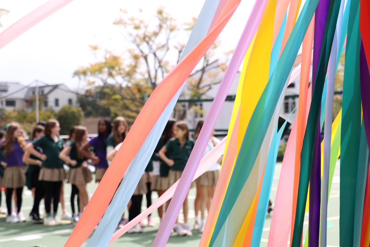Ribbons+of+the+practice+Maypole+float+in+the+breeze+on+the+sport+court+during+sixth+grade%E2%80%99s+Maypole+rehearsal+May+2.+Sixth+grade+Dean+of+Community%2C+Culture+and+Belonging+Natalie+Kang+described+the+Maypole+as+a+rite+of+passage+from+sixth+to+seventh+grade.+Sixth+grade+will+continue+to+rehearse+up+to+their+performance+May+31.%C2%A0