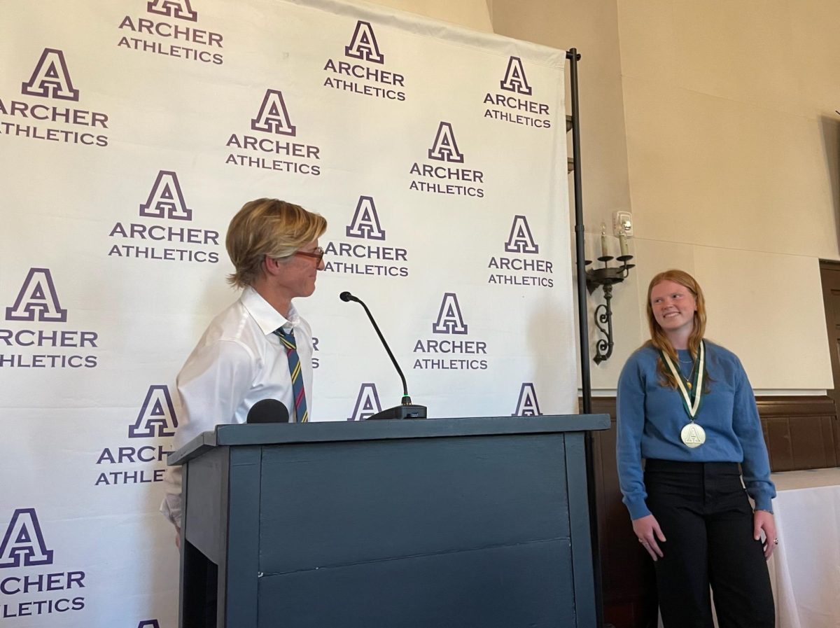 Athletics Director Kim Smith recognizes senior Cate Childers accomplishments during her soccer season. The Athletic Awards Night was held May 14 to honor athletes contributions to their teams and to bring together the community to celebrate their achievements. 