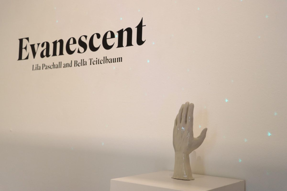 The title of this senior show, Evanescent, is shown behind one of Lila Paschalls pieces: a sculpted clay hand. Hannah Kremin described their process of choosing the name for their show. It seemed like they stumbled across that word and they found the meaning and they were like this is it, Kremin said.