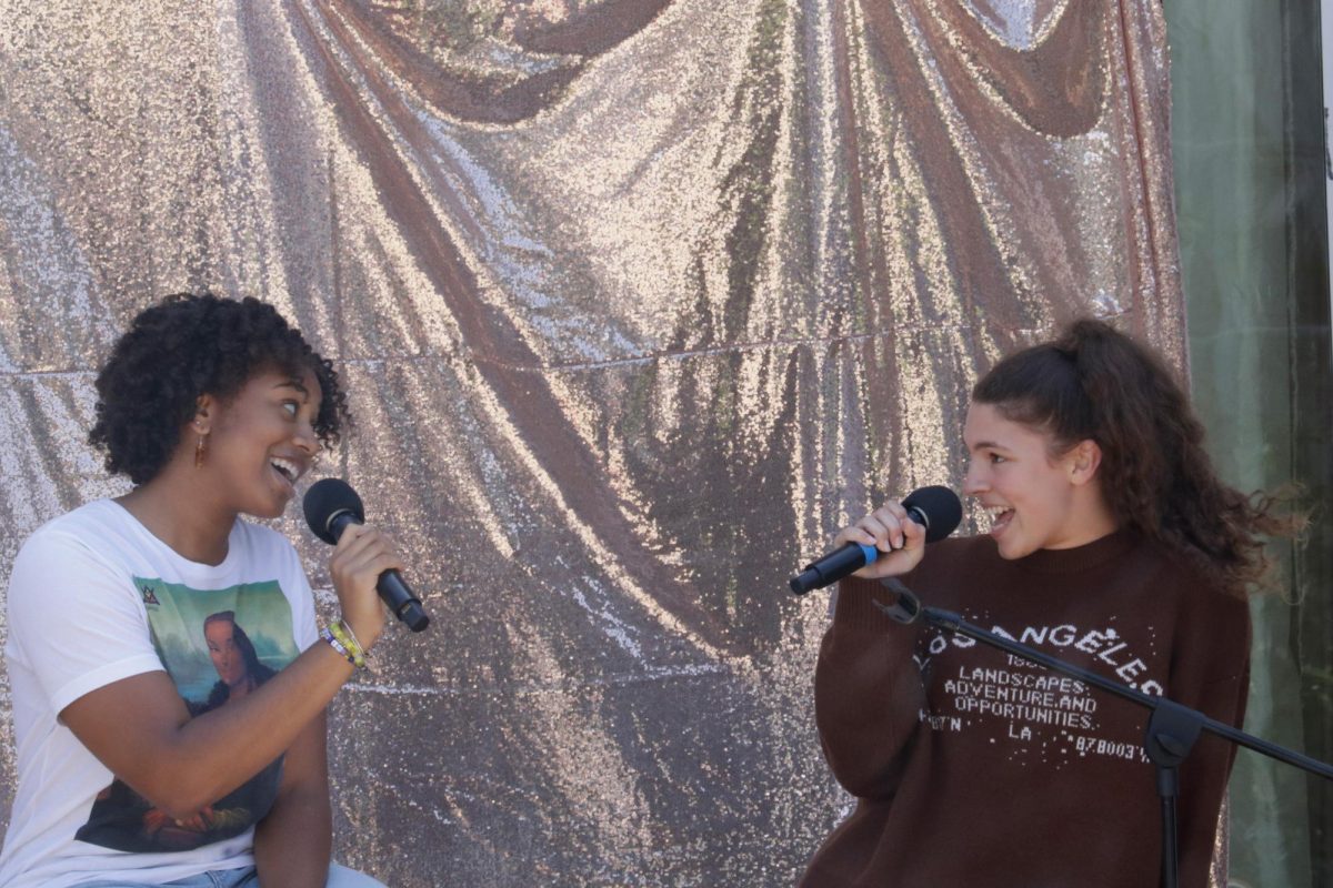 Senior Anaiya Asomugha and junior Bryce Collis sing a duet at Archella. Archella took place Friday, April 26, in the courtyard. 