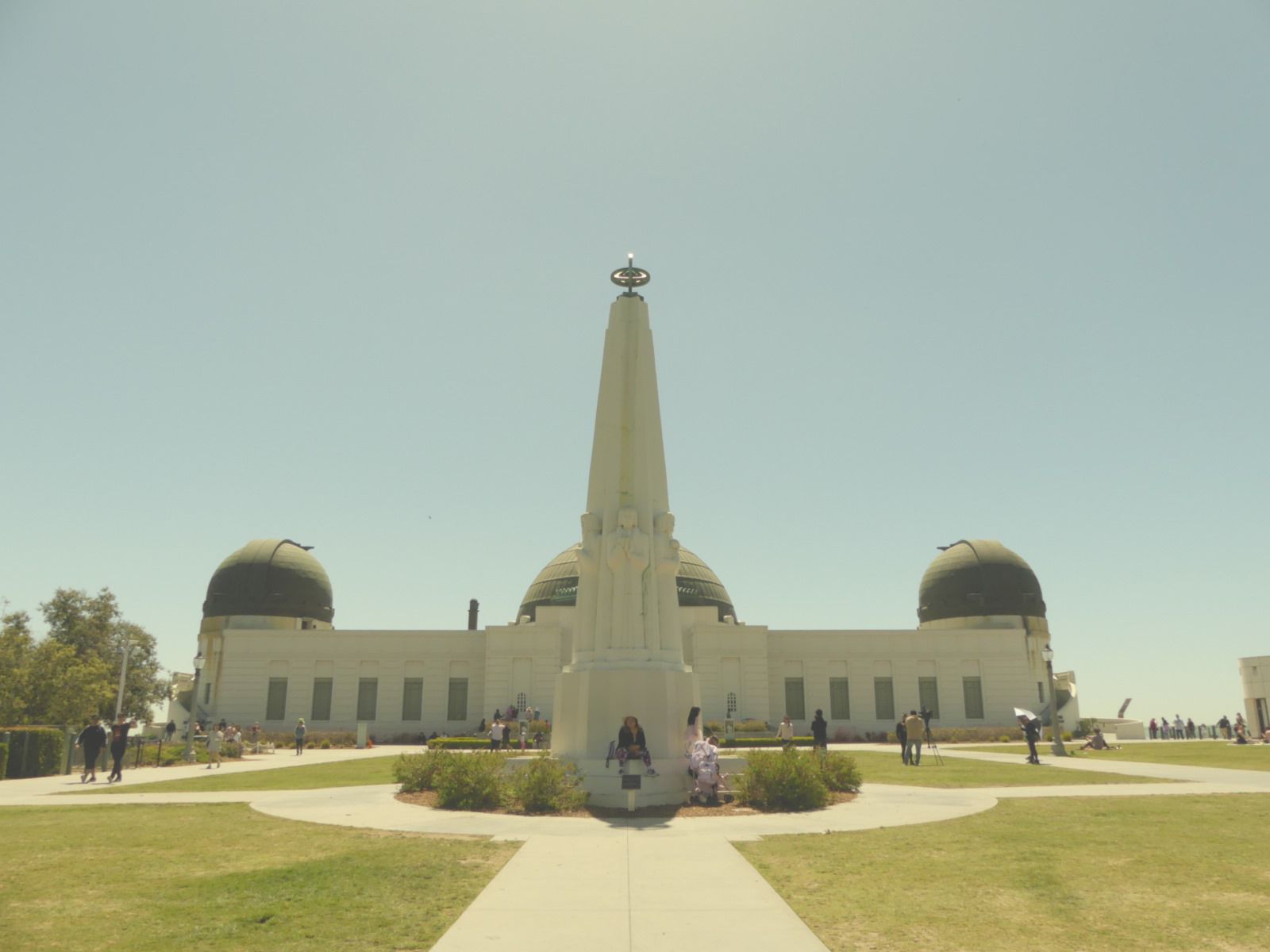 Visitors walk around the exterior of the Griffith Park Observatory. Located in the hills between Hollywood and Los Feliz, the observatory is a beautiful L.A. landmark. (Photo credit: Mika Drori)