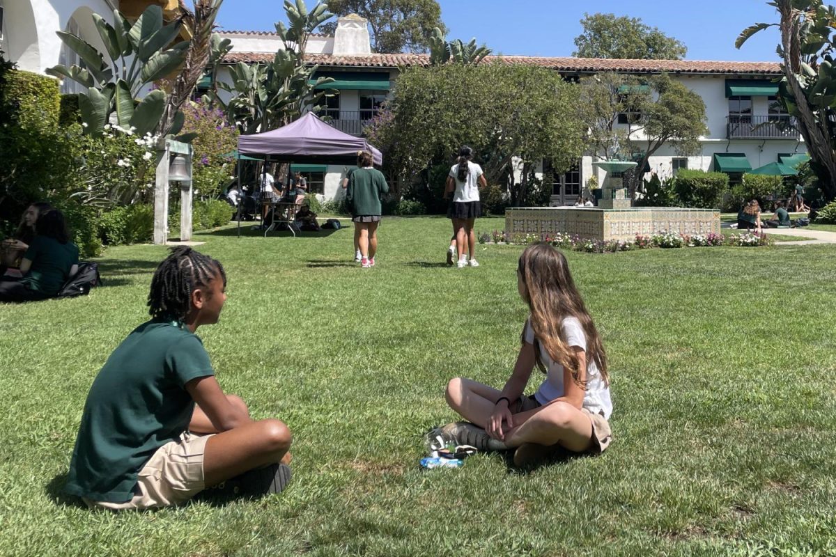 Sixth graders eat lunch in the courtyard,  on a bright sunny day. Four sixth grade students said they feel both nervous and excited for their first year at Archer. 