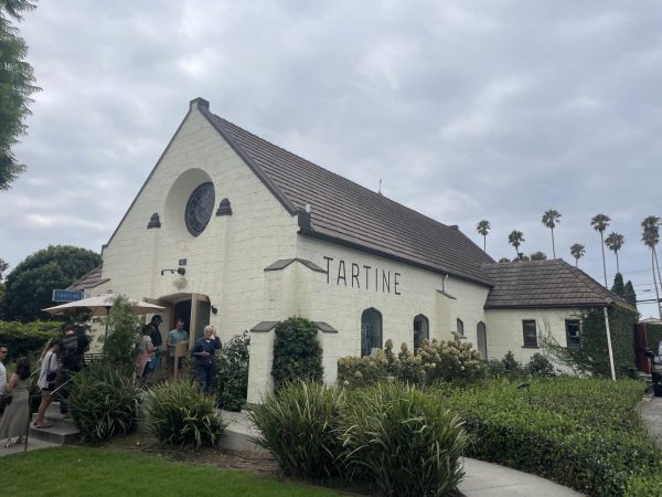 The restaurant Tartine sits surrounded by a green garden. Tartine is a brunch spot, located in Santa Monica, Los Angeles, CA. This location is one of the many locations Tartine owns across Los Angeles.