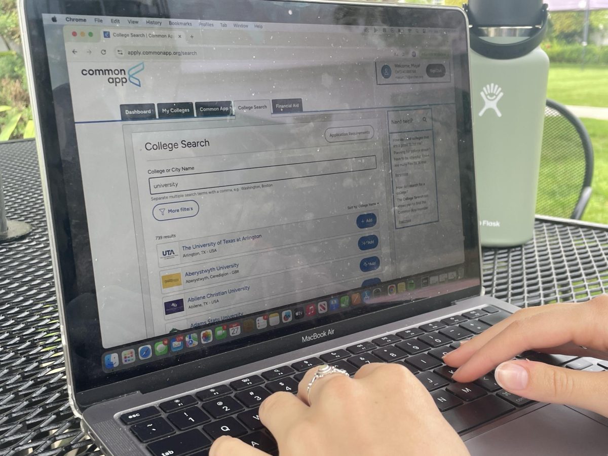 A senior browses through universities and colleges on Common App. Common App was founded as a platform for students to submit college applications. 