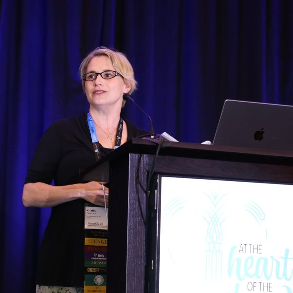 Speaking at the opening ceremony of the spring National High School Journalism Convention, Kristin Taylor, MJE, announces the 2024 First Amendment Press Freedom Award winners. Twenty-eight schools received the recognition, the highest number in the award's history.