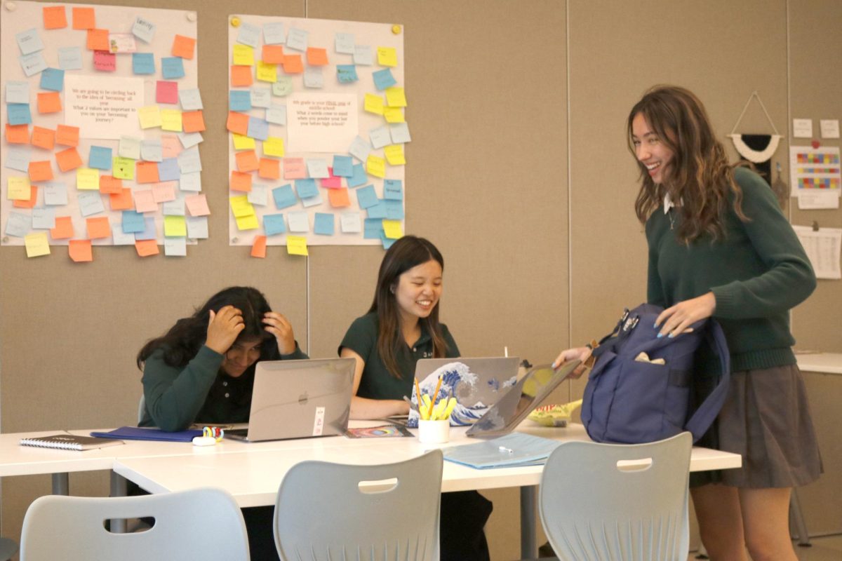 At a Power Hour session, tutor Allie Yang ('25) laughs with Lily Poon ('25) and Danilka Foronda-Zanipatin ('25). Yang said a goal of Power Hour is to help students feel capable. "I really want to develop that individualistic confidence in my tutorees," Yang said.