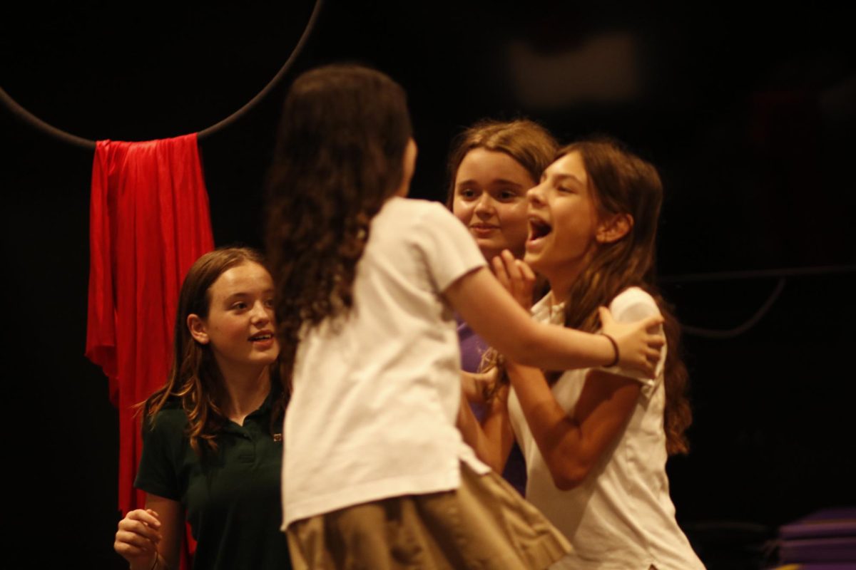 Members of the seventh grade Improv Team Sofia Micelli, Ellie Epstein, Delainy Lloyd and Elle Brutocao improvise a scene during their lunchtime performance Monday, Oct. 27. Their scenes were randomly selected by audience participants, and were all Halloween-themed.