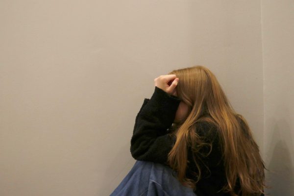 A girl leans against the wall with her head in her hands. The emotional and mental toll of sexual assault paired with victim blaming can be incredibly damaging to survivors. “When it comes to domestic violence or sexual assault, you didn't have a voice in it,” Morales said. “Something happened to you that you didn't want. So then to continue to experience that after, is continuing the harm.”