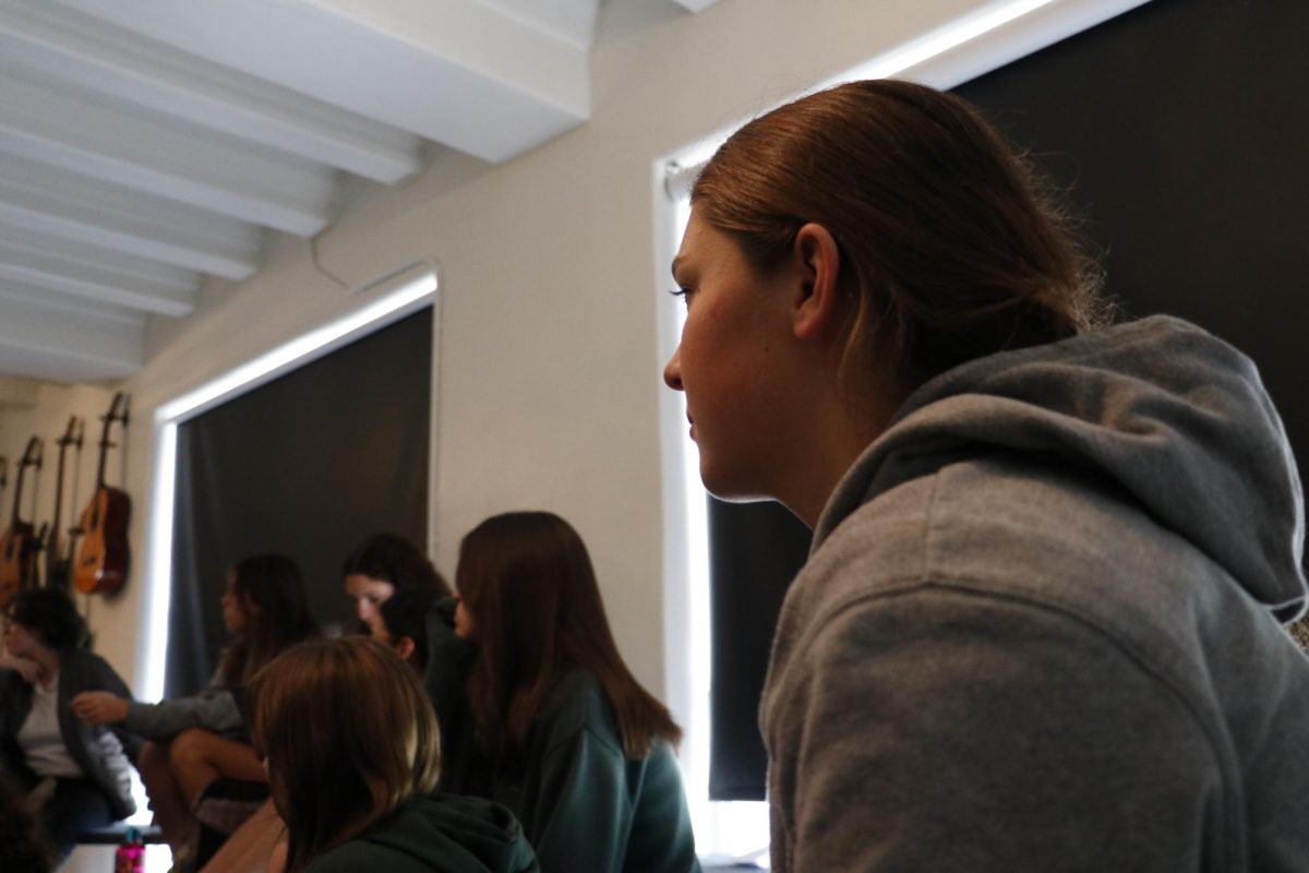 Archer Council for Sustainability member Charlotte Titmarsh ('27) listens to their weekly meeting in the Choir Room. 