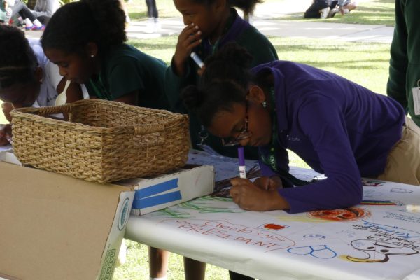 Students draw in the courtyard to unwind following the announcement of President Donald J. Trump's reelection Wednesday, Nov. 6. Illustrations included drawings in support of Vice President Kamala Harris and an array of colorful doodles.