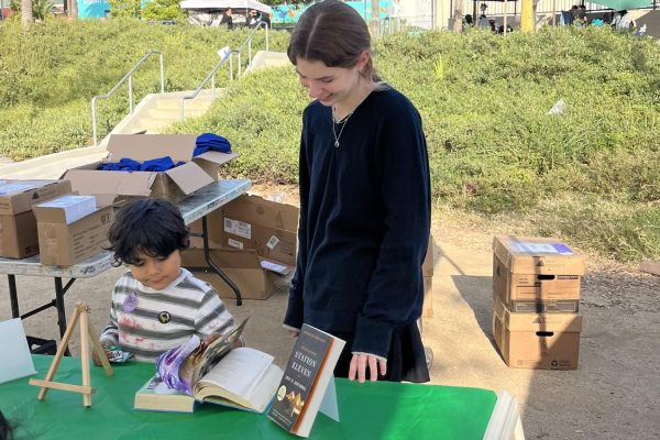 Tattered Tales Founder Natalie London ('26) runs a book fair to provide free books children living in underserved communities. London donates her own books and also collects books from her local communities, such as Archer. 
Photo provided by Natalie London. 