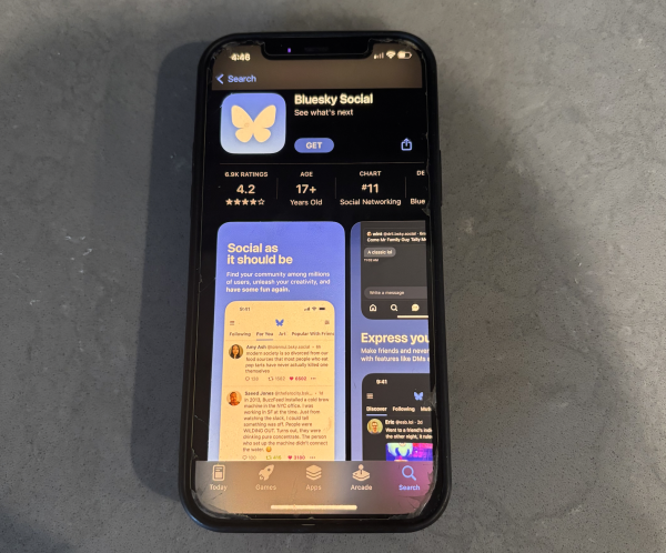 An iPhone displays Bluesky on the Apple app store. Bluesky is a new form of text-based social media that aims to give users more autonomy and less overwhelm. 