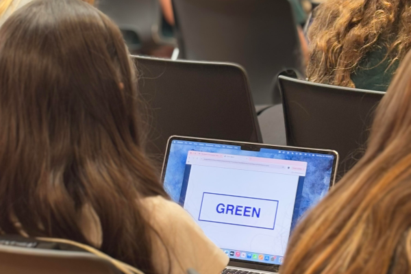 A student athlete takes the concussion test with her screen displaying the word green in blue coloring. According to the National Library of Medicine, "in all sports, collegiate athletes had higher rates of concussion than high school athletes, but concussions represented a greater proportion of all injuries among high school athletes."