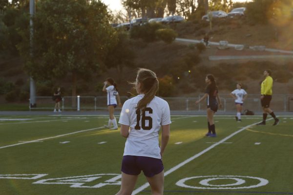 Emmy Rapp (‘27) walks onto the soccer field, ready to play. Windward was the team's first opponent, with Brentwood being their second. Both games were played after winter break and the containment of the Los Angeles fires, which halted practice. “It went from us being about to start the second half of the season to just crickets. It was a challenge for sure,” Fish said. “And we’re in a new league so we're playing against teams that are better than us. It's been a season of many growth opportunities.”