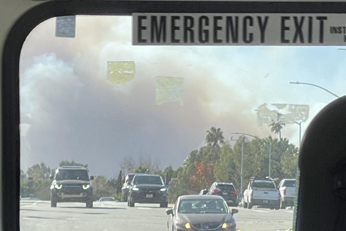 Smoke rises from the Palisades wildfire as a bus departs from the Archer campus. As the fires burned — and even in the aftermath of them — Archer took the lead to ensure students felt supported academically, mentally and physically. (Photo provided by Isabella Argiropoulos).