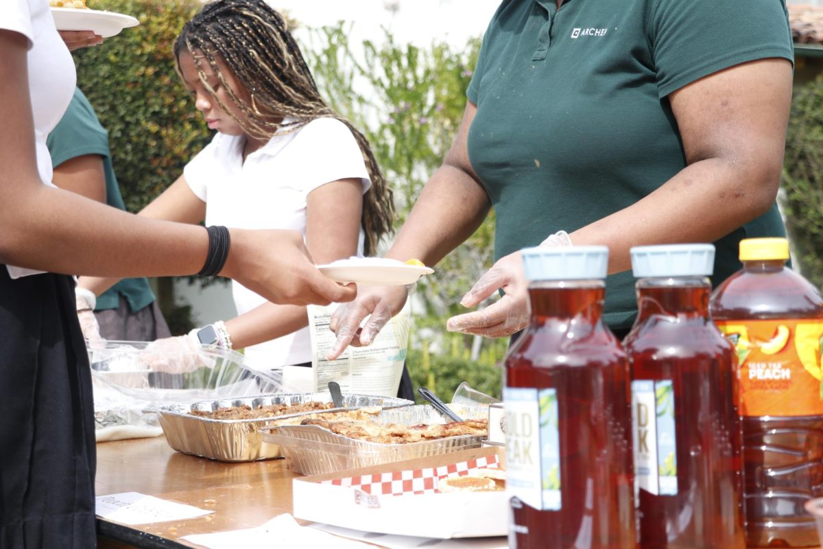 Iced tea and peach pie are displayed on tables for students to try. Simonne McDavid ('25) said she brought yams because they are important to her family. "Usually for Christmas, my grandmother makes yams," McDavid said. "She makes all other types of dishes, but yams are special because spelling she doesn't make it all year round." 