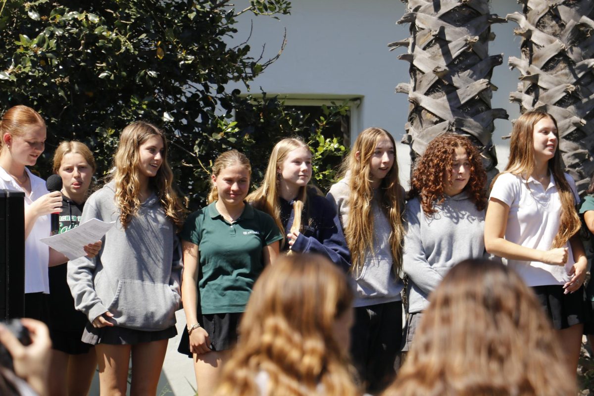 Standing side-by-side, the varsity beach volleyball team is celebrated for this season's accomplishments. Smith said pep rallies build school spirit and community, as students come together to celebrate each other for the spring season. "Our athletes are doing such amazing things," Smith said. "Many of our sports are off campus, so a lot of our students don't get to see our teams compete; to be able to share that with them on campus is incredibly special."