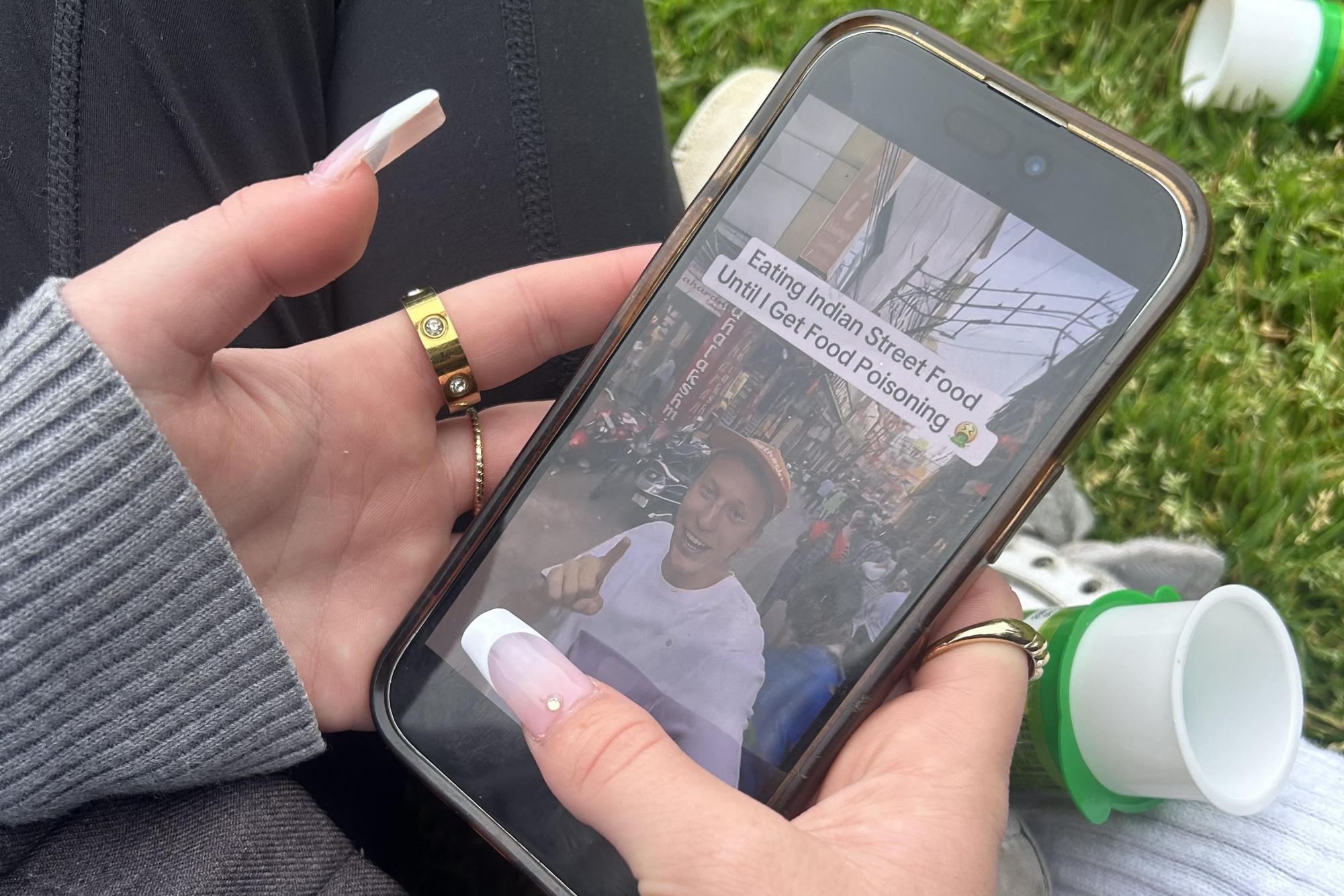 A student views a video that introduces a challenge to "Eat Indian food until I get food poisoning." Videos like these can be found all over social media spreading racist views and ideas.