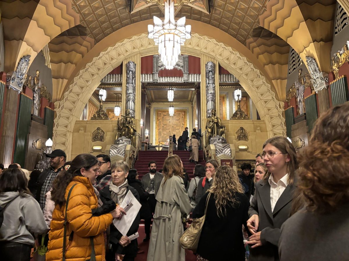 Teacher and students wait to enter the theater in the Pantages theater lobby. Archer offered free tickets for any high school students interested in attending "Suffs." Written by Shaina Taub, "Suffs" opened on Brodway in 2024. The musical follows a group of five influential leaders from the Suffrage Movement. 