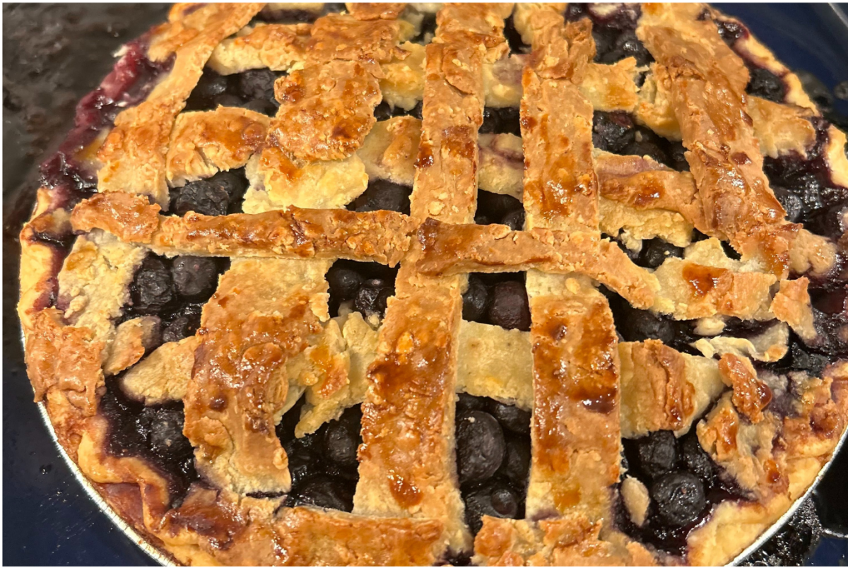My homemade blueberry pie lies on a table after being baked. The months of November and December often prompt us to diverge from our usual routines and relinquish control over our eating habits, which can stimulate intense body image anxiety. However, it's also the perfect time to give ourselves grace and practice body acceptance.