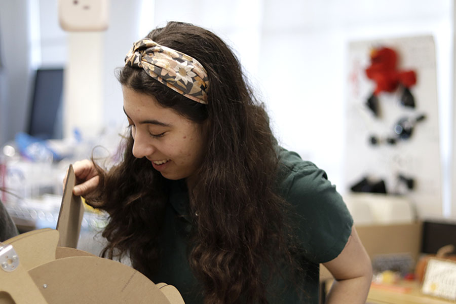 Measuring a piece of hardwood, Lucy Kaplan (‘26) tends to a robot during an after school robotics session. She is one of the co-captains of The Muses, Archer’s robotics team, which meets in the Saban IDEALab every Wednesday after school and during FLX Block. "I think I have become a more confident person because of all the things that I'm involved in," Kaplan said. 