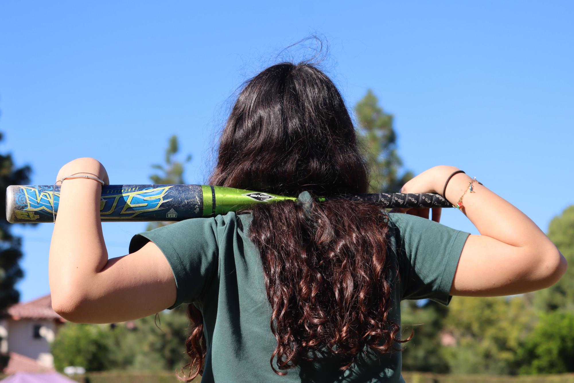 An Archer student holds a baseball bat across her shoulders. At a young age, many female baseball players abandon their sport due to discouragement from coaches and a lack of professional opportunity, said athlete Michelle Roche. The Women’s Professional Baseball League (WPBL) intends to challenge this occurrence, and will commence its inaugural season in Aug. 2026, featuring four teams: Boston, New York, San Francisco and Los Angeles. 