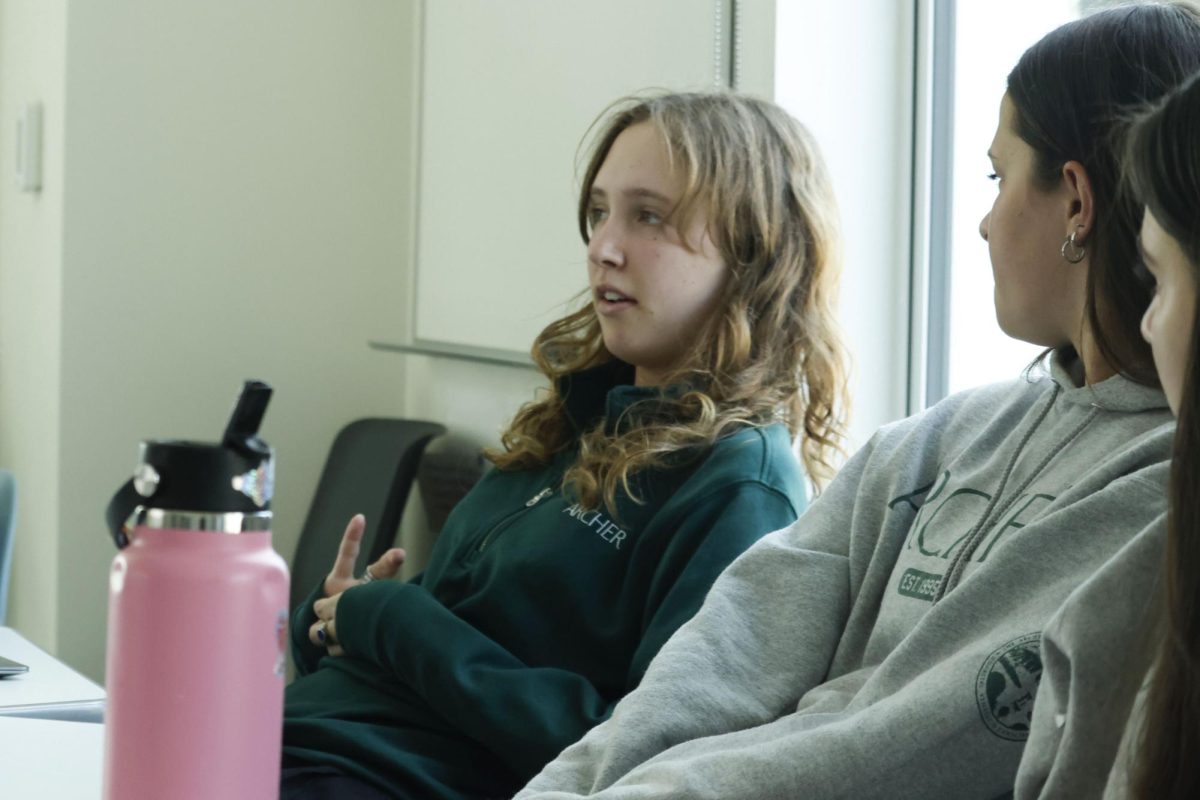 Sophomore Laila Boodell participates in ArtemisEngage as others listen attentively. The Artemis Center's discussion focused on student perspectives about being open to changing their beliefs.