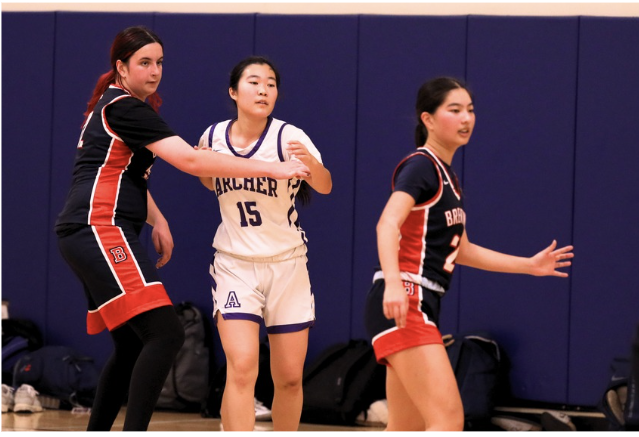In a game against Brentwood school, senior Alexa Kagiwada guards another player. Kagiwada began playing basketball in elementary school and has played for the Archer team for the past three years. "The Archer team fostered a more positive environment," Kagiwada said. "I was able to challenge what I thought before about what it meant to be a basketball player." (Photo courtesy of Alexa Kagiwada)
