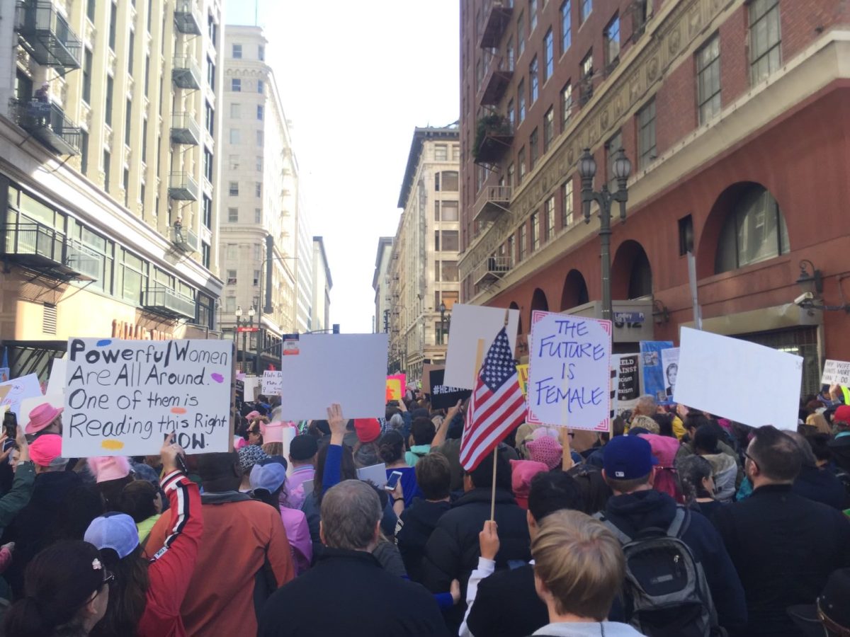 Protesters at the 2017 Women's March in Los Angeles hold up signs demanding equality for women, which includes bodily autonomy and reproductive freedom. The dual resurgences of conservatism and diet culture reveal the ways the dominant culture is politicizing the female body. (Photo courtesy of Audrey Wauchope)