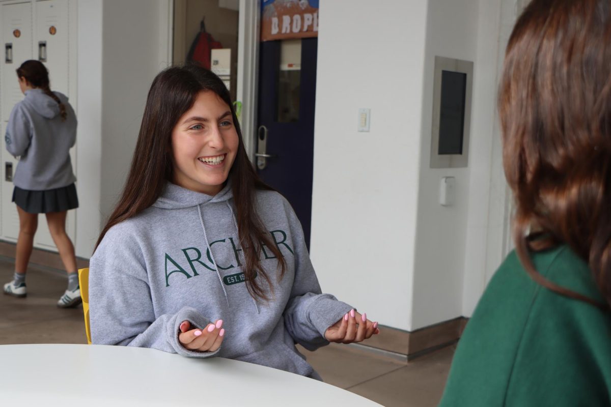 Mara Krauss ('29) talks with a peer about the work of the Jewish Center for Justice (JCJ). The group meets every other week to plan advocacy efforts and raise awareness about California legislation. "I worked on various bills during the summer that were meaningful to me," Krauss said. "It was such a fun learning experience."