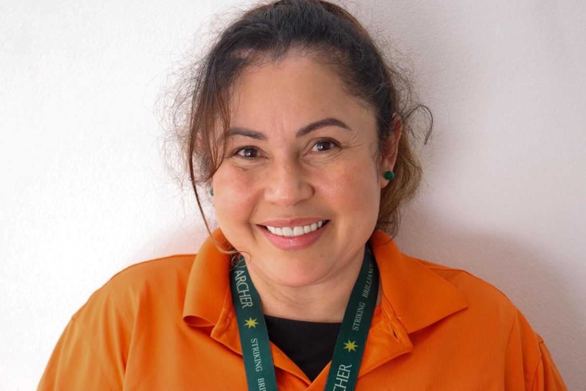 Facilities member Marta Sorto poses for a photo. Sorto joined the Archer staff in 2023 and said she enjoys Archer's ideas. " Every time they remove
something, it is because there are new ideas, and they are better, and that is important," Sorto said.