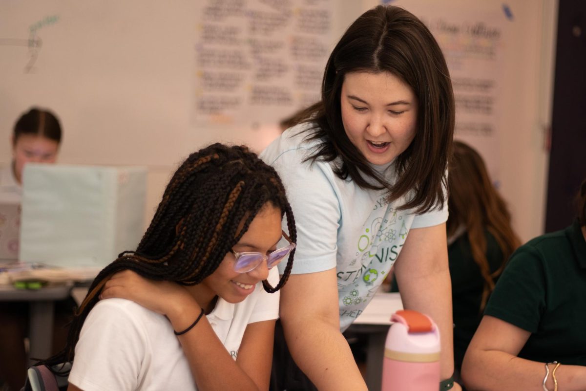 Anne Mansfield gives advice to a student during a math class. Mansfield has always valued letting her students guide themselves through the lessons more, but sometimes, she said, guiding them through is necessary to make sure they fully understand.