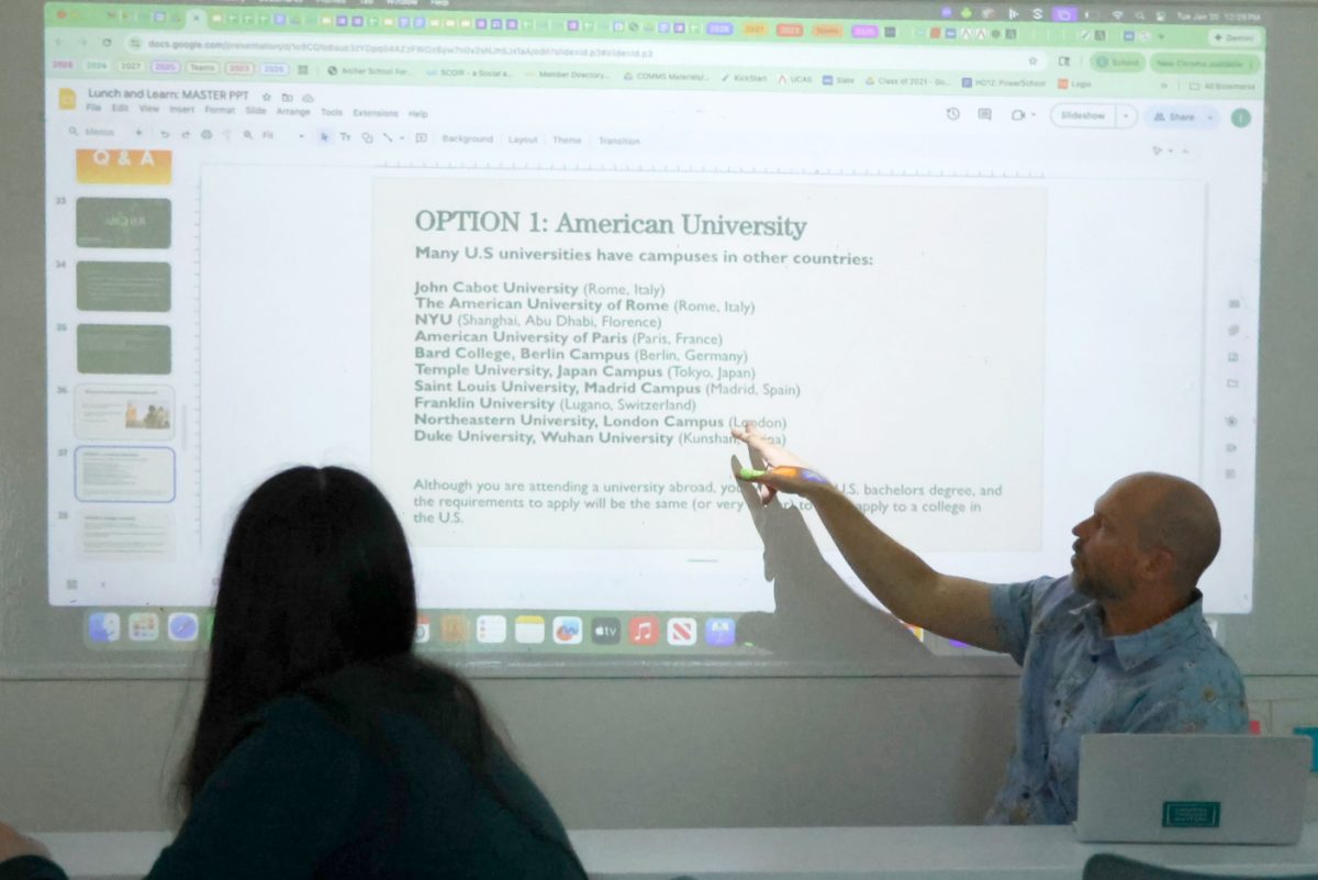 College guidance counselor Ivan Hauck presents about international colleges and universities at a Lunch & Learn meeting Tuesday, Jan. 20. Ninth through 11th graders were invited to attend the meeting. Clara Lieberstein ('28) attended the Lunch & Learn to explore options for college. "I think that it's just such an important experience to be able to experience a different culture and be immersed in a different language and be surrounded with people from other countries," Lieberstein said.