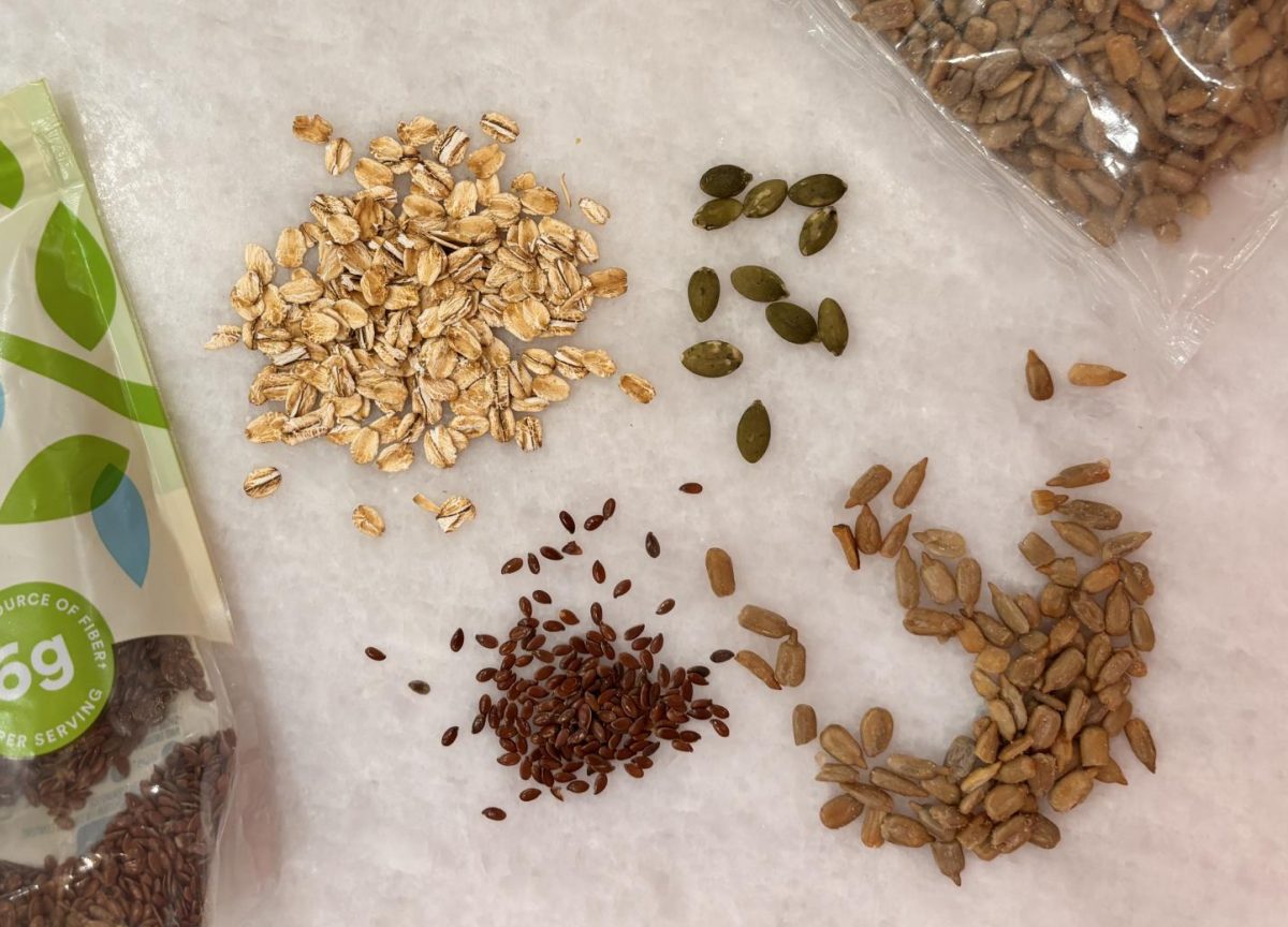 Different types of grains are displayed on the countertop. Restoring ancient grains helps increase biodiversity and has enormous benefits to human health and the planet.