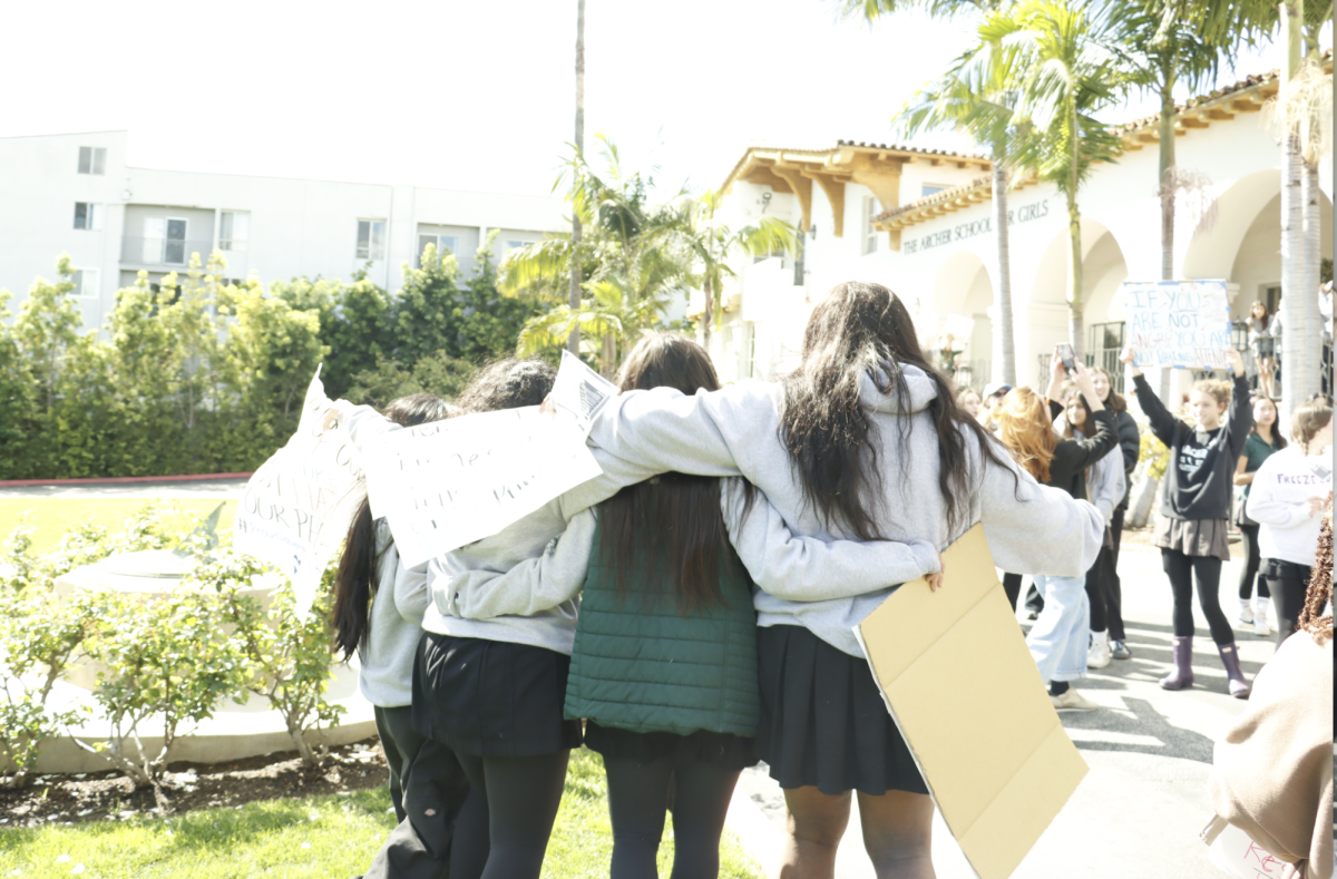 Following the protest, student organizers embrace in a hug together. Fuentes reflected on her pride in the Archer community. “We knew not everyone would support or be involved,” Fuentes said. “But to just go on and support our people was bigger than that. We couldn’t have done it without the students and teachers who came along and helped us”