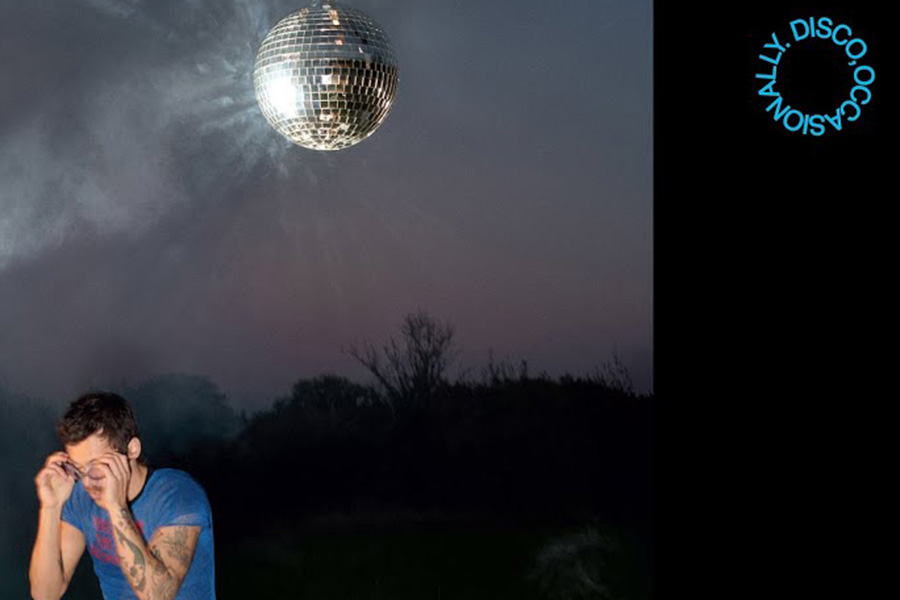 A shimmering disco ball hangs as Harry Styles reaches for his glasses. Styles announced his upcoming album Kiss All The Time. Disco, Occasionally, set to release Mar. 6, dropping his first song off it, Aperture. Kate Rheinheimer ('28) is a Styles fan and frequent listener to his music. "I opened [Aperture] on Spotify and just listened," Kate Rheinheimer said. "I'm so excited to see what his album brings.” (Promotional image from Columbia Records) 