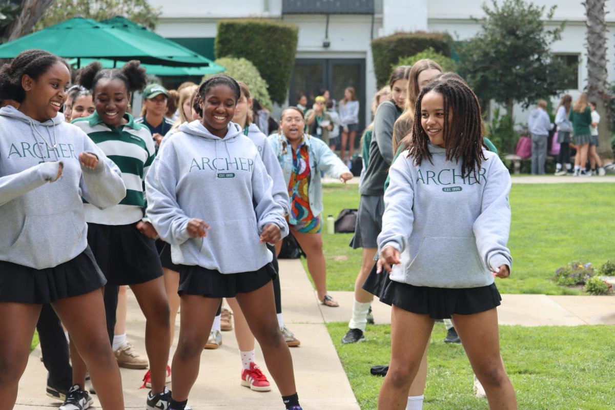 The Archer community dances in a kick-line, following the lead of Black Student Union members. BSU adviser Sala Bandele-Jackson was among the crowd and said BSU's love of sharing art was what the festival was for. "There were some things that we had to cut just for the sake of time, but they wanted to also show students art," Bandele-Jackson said. "BSU has students literally doing all different types of things in all different types of areas, and they really want to showcase that."