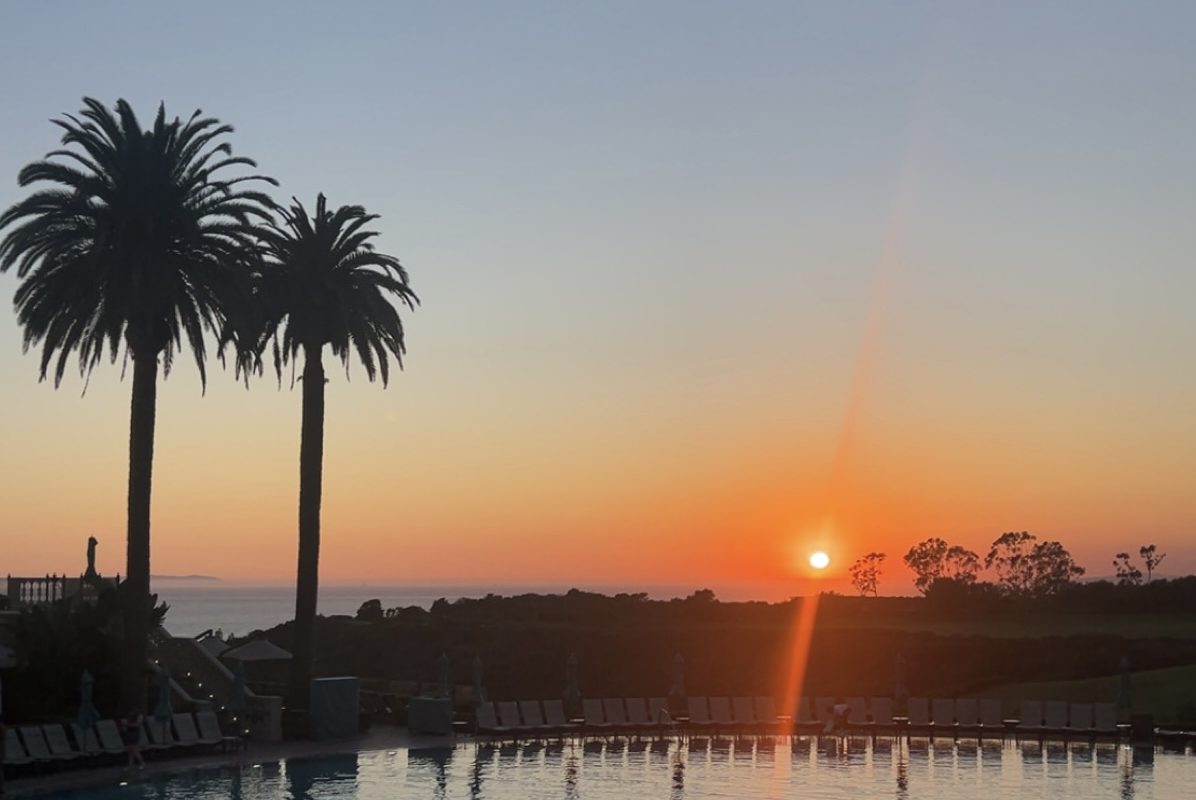 The sun sets in the evening at the edge of a pool. When we turned our clocks back an hour on March 8, the start of Daylight Saving Time, it began to stay lighter in the evenings and darker in the mornings. According to the National Library of Medicine, DST causes health defects like heart attacks, strokes and it can mess with our hormones.