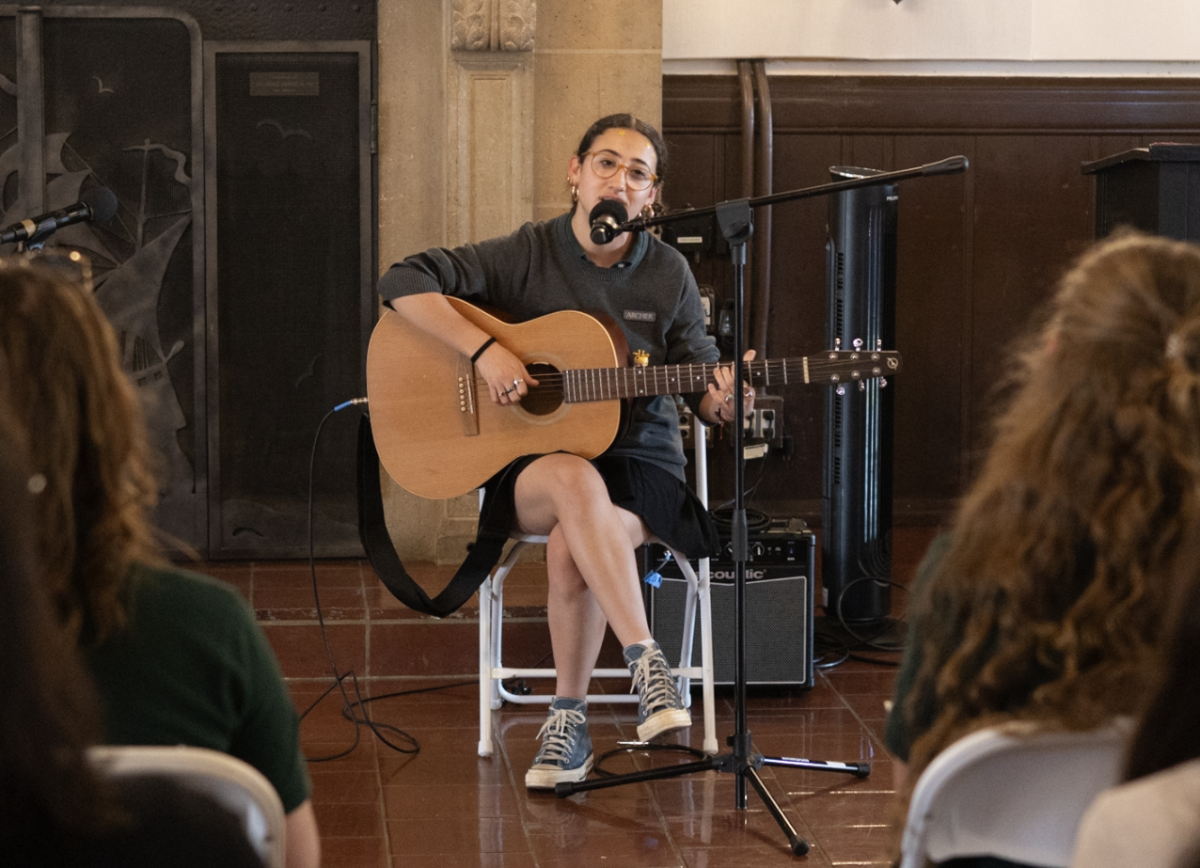 Emerson Cohen ('26) performs an original song for the second annual coffeehouse March 19. "Everyone here just wants to help students get their voice out," Cohen said. "Coffeehouse is such a safe space."