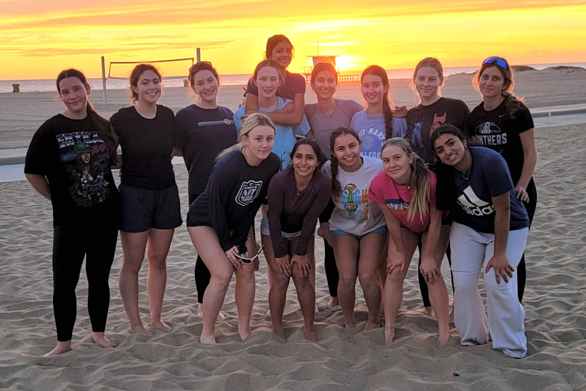 The Archer varsity beach volleyball team poses for a photo after practice at the Annenberg Beach House in Santa Monica. Players travel to the beach several times a week while balancing schoolwork and other commitments. Despite the commute, the team comes together on the court to focus and practice, Luella Moshtaghi (‘28) said. (Photo courtesy of Kim Smith)