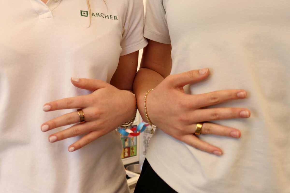 Emmy Rapp ('27) and Pasha Selig ('27) wears their Oura rings during their yearbook class. They wear their smart rings everyday, and only take them off when they need to charge it. However, the ring usually lasts for seven days. 