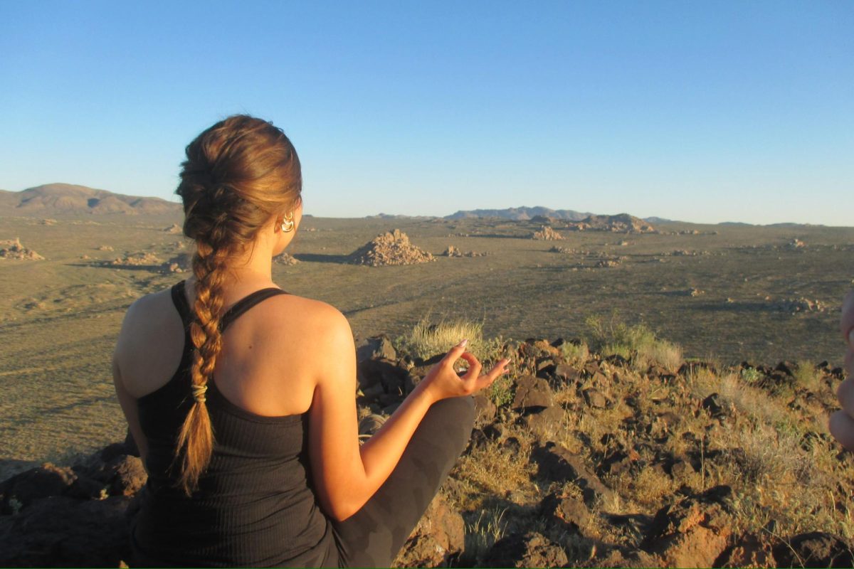 Sophomore Izzy Escalante sits in a zen pose atop a hillside in Joshua Tree National Park. The Class of 2028 went on a weeklong backpacking trip from March 23 to March 27. "I really enjoyed Arrow Week because I feel like it was such a detox from the overstimulation of high school and living in Los Angeles, especially without my phone and getting constant notifications," Escalante said. "I really enjoyed nature without the distractions."